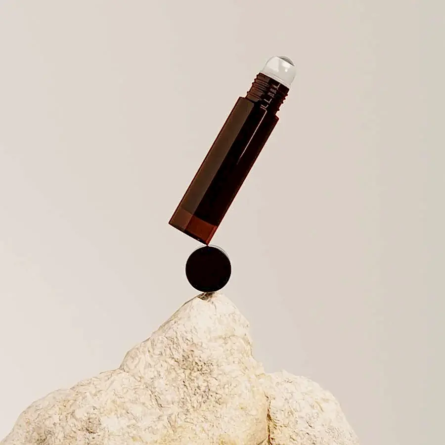 amber glass roller bottle mockup, open black plastic cap, brown