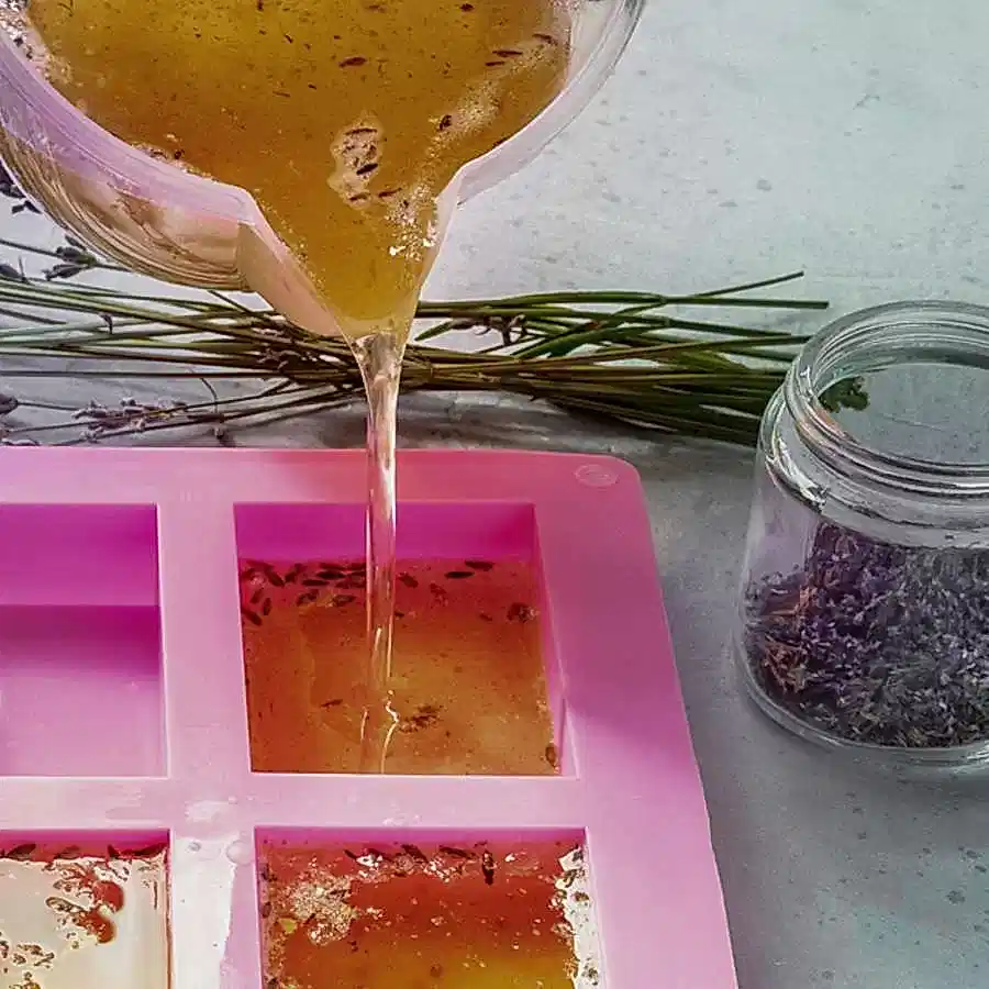 Soap making at home. Liquid glycerin with the additives of peels and flowers